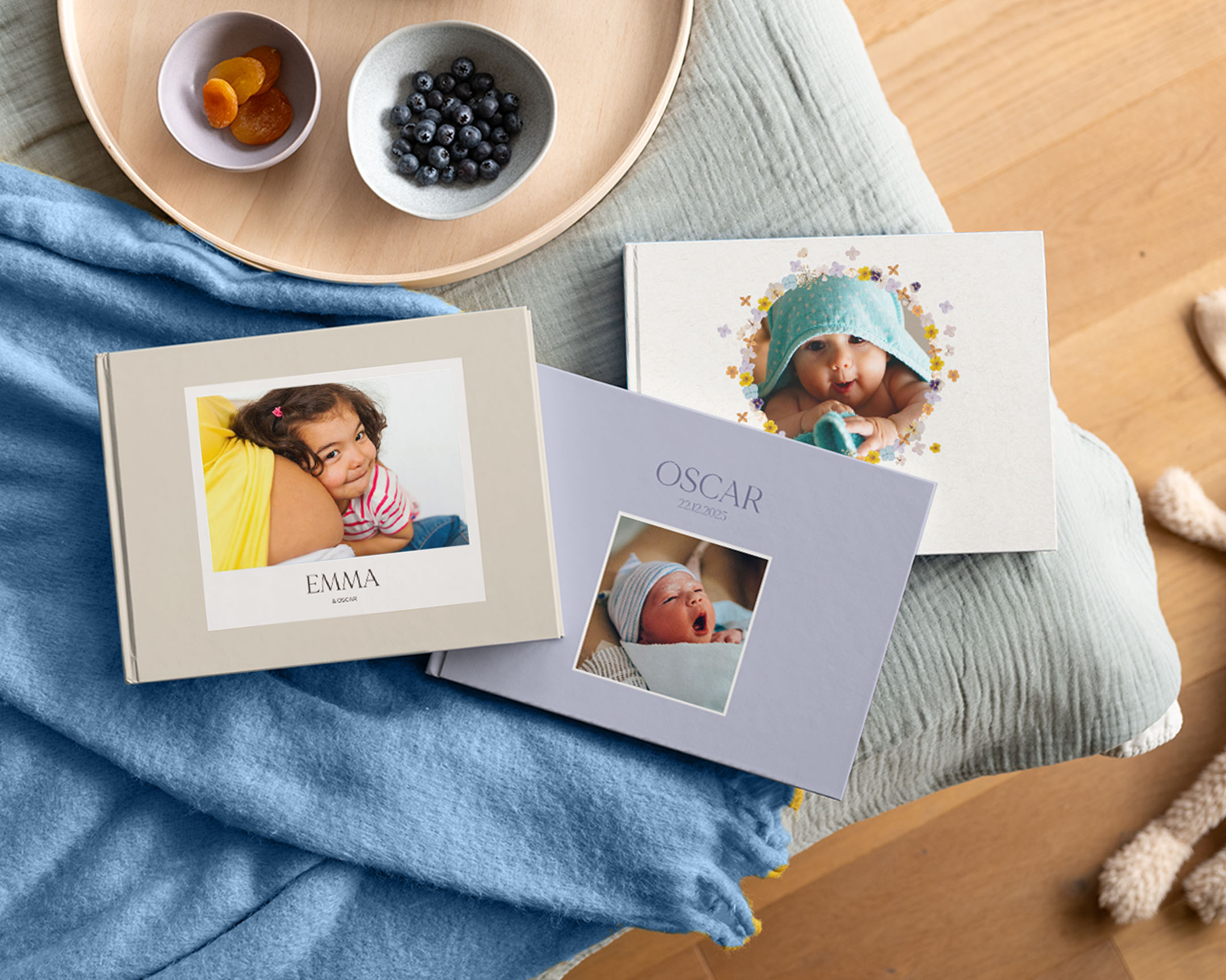 Personlige babyfotobøker med babybilder på omslagene.